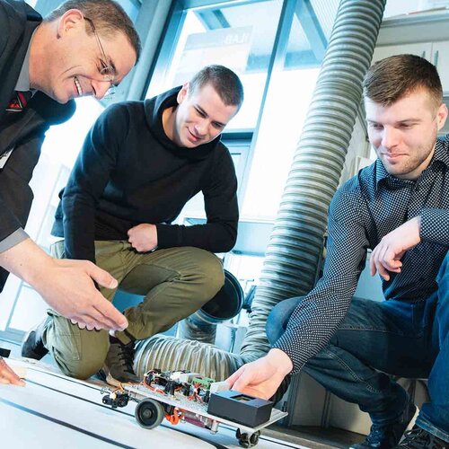 Professor with students in the CAMRA Lab